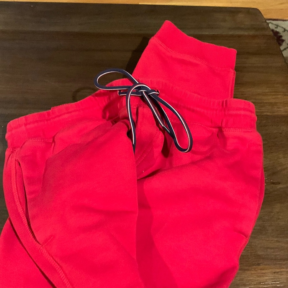 Men’s Tommy Hilfiger red sweatpants with red white and blue drawstring